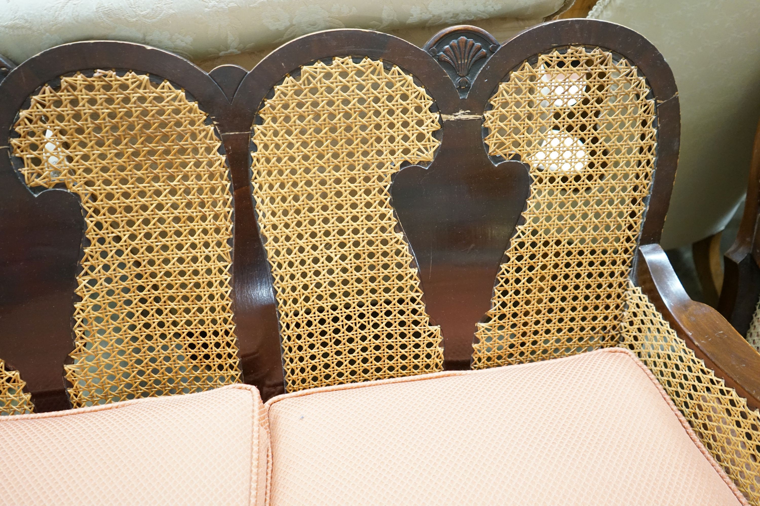 A 1920's caned beech two piece bergere suite, sofa length 167cm, depth 178cm, height 80cm